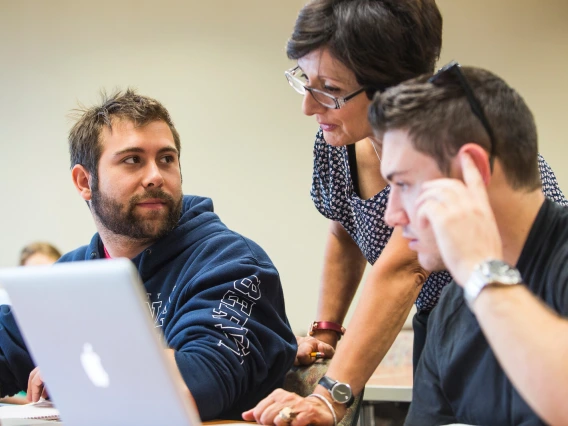 Students getting help with their research assignment