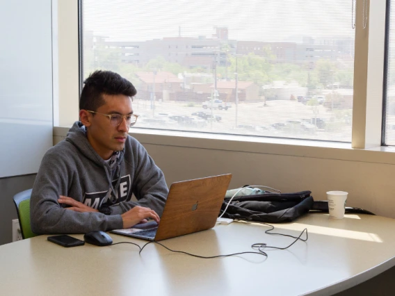 student sitting at study room table