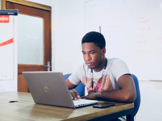 African-american man using laptop