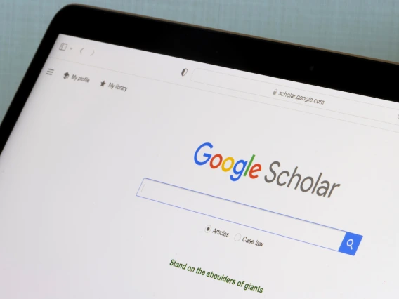 Laptop screen showing Google Scholar