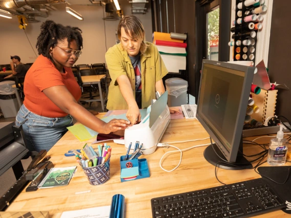 Two students working on a creative project in CATalyst Studios