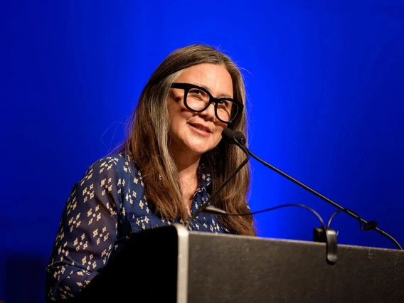 Jen Nichols speaking at a fall convocation