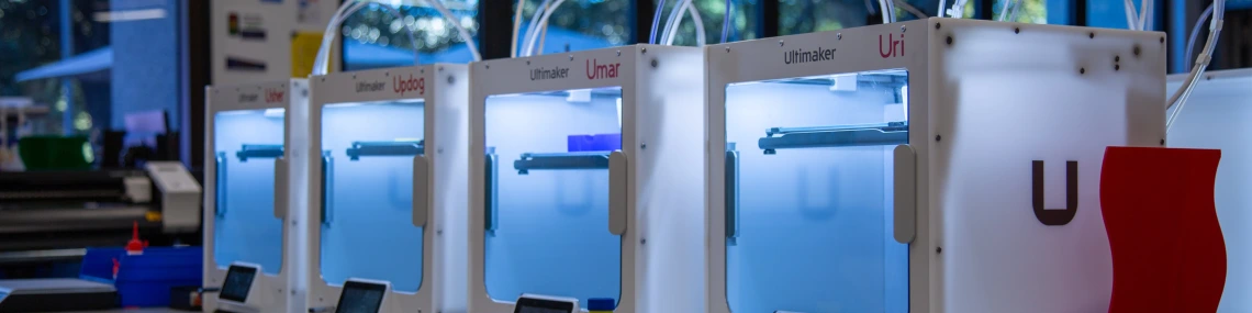 Several 3d printers on a table at CATalyst studios