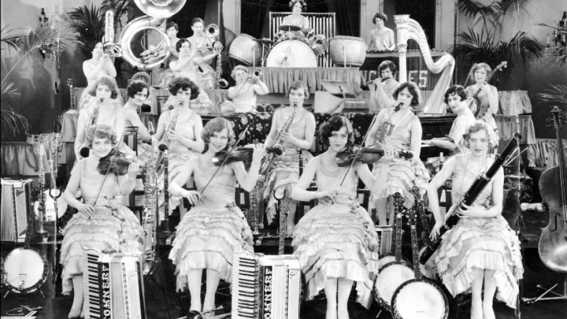 Women playing musical instruments on stage