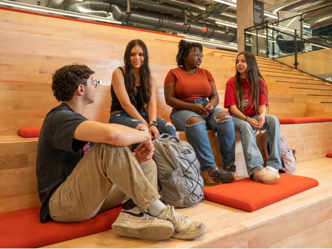 Group of students chatting in Main Library