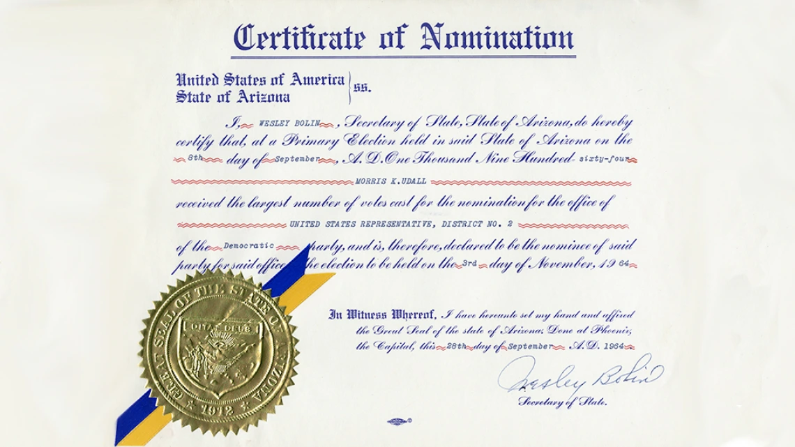 Morris Udall's Certificate of Nomination for Arizona State Representative. The certificate features a gold embossed seal and a blue and gold ribbon.