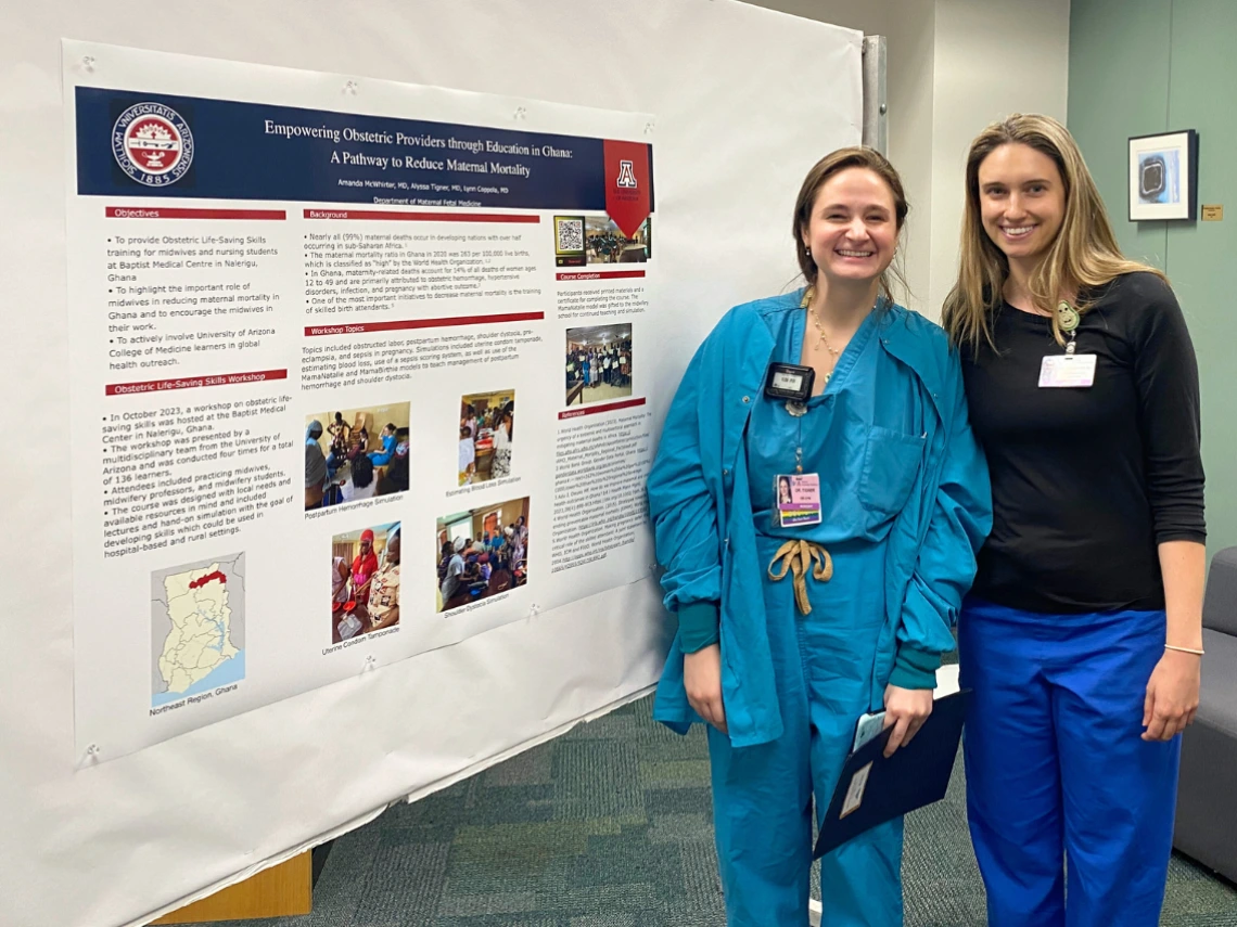 Two College of Medicine-Tucson Global & Border Health students pose by their poster