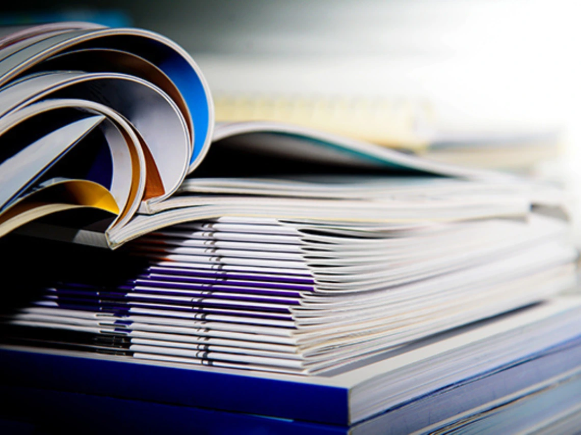 An open stack of journals and magazines