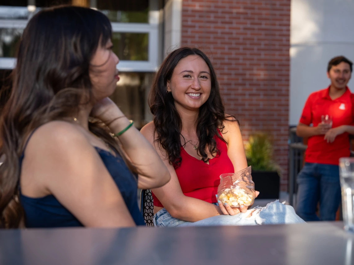 Students mingling with each other and smiling