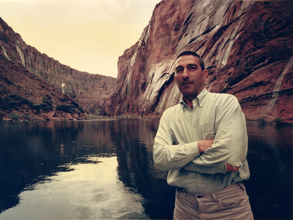 stewart udall standing near water in a canyon