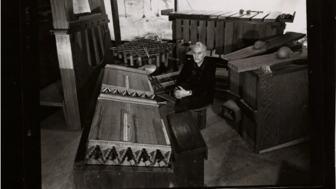 Photograph of Harry Partch Surrounded by His Handmade Instruments, undated