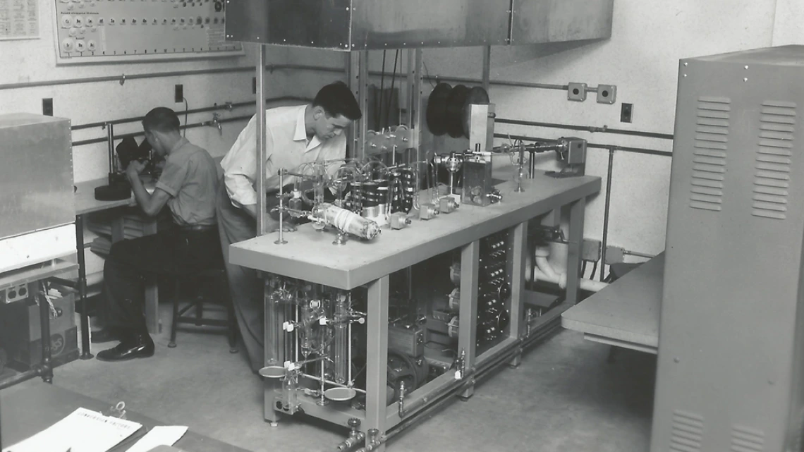 Laboratory with two men working with microscopes and equipment