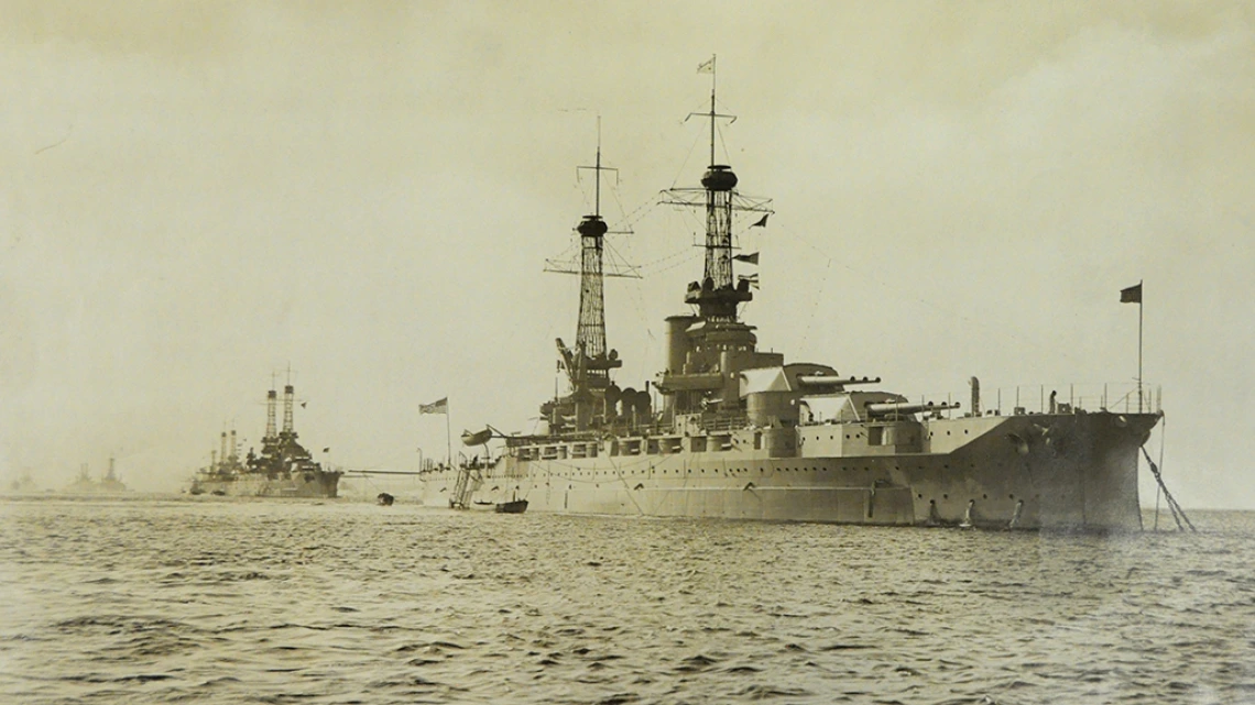 Sepia toned photo of the USS Arizona at Sea with Unidentified Ships in Background, circa 1927