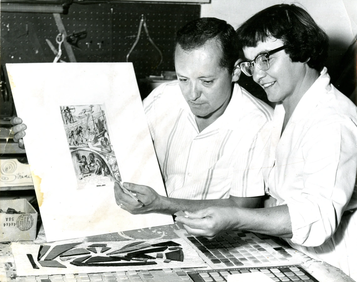 Charles Clement and His Wife, Louise Edmea Black and white photograph of artist Charles Clement and his wife, Louise Edmea, admiring an illustration by Clement.