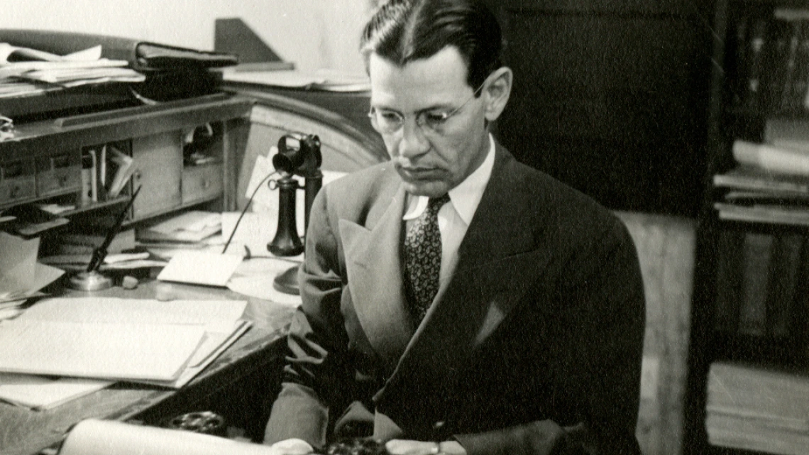 George Chambers working at his desk