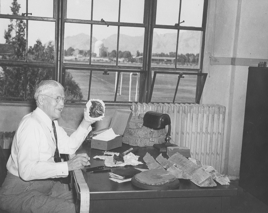 Andrew Ellicott Douglass at his desk in his lab office