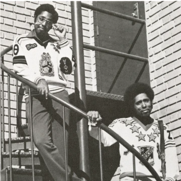 two men standing on stair case