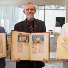 Cynthia White, Albrecht Classen, Paul Milliman holding books