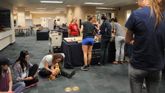 Therapy dog, students and snacks at Finals Coffee Break