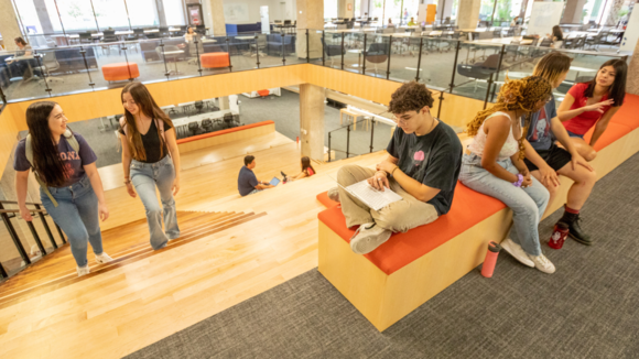 Students studying and chatting in Main Library