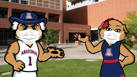 Wilbur and Wilma with face coverings in front of the Health Sciences Library