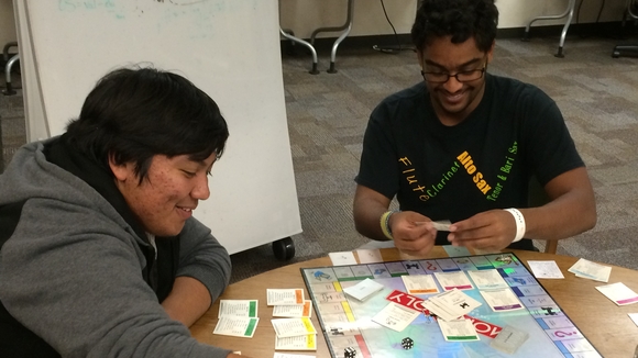 Students playing board game