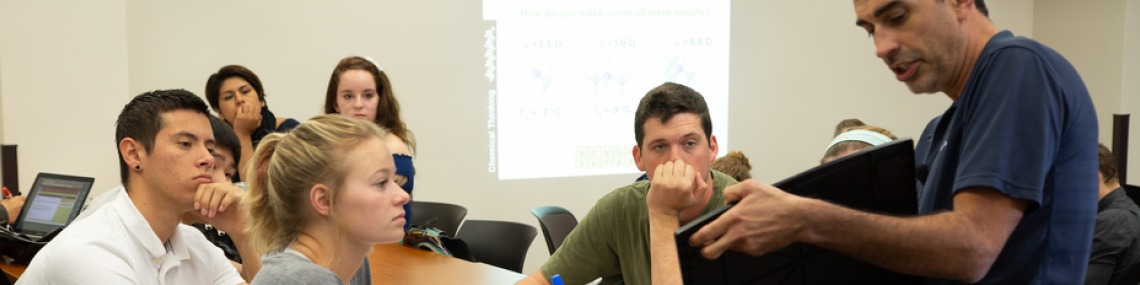 Instructor teaching students at the library.