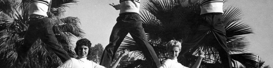 Black and white photo of male and female UA cheerleaders from the 1950s