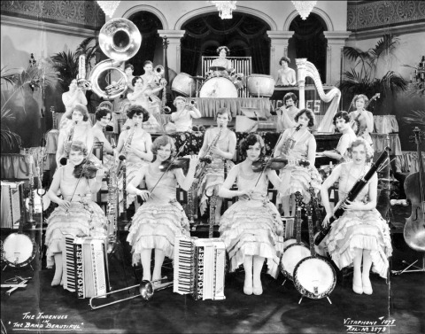 Black and white photograph of an all-female band, The Ingenues, from the 1928 motion picture The Band Beautiful
