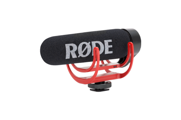 A black microphone on a red stand with the "Rode" brand name written in white letters.