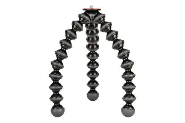 A black mini tripod with flexible and bendable legs. The legs have many spherical protrusions to help attach the tripod to different objects.