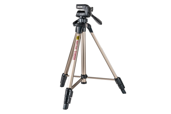 A gold and black medium sized tripod with retractable feet. It also has a pan head with a handle.
