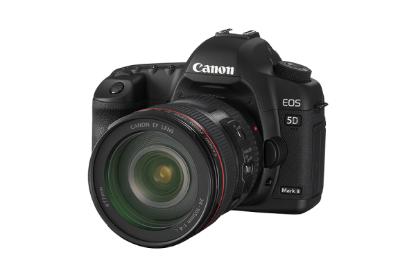 A black Canon 5D mark two DSLR camera with a lens mounted.