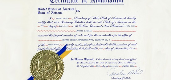 Morris Udall's Certificate of Nomination for Arizona State Representative. The certificate features a gold embossed seal and a blue and gold ribbon.
